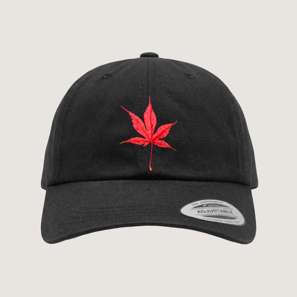 Maple Leaf Cap — red maple leaf on a black low-profile dad cap