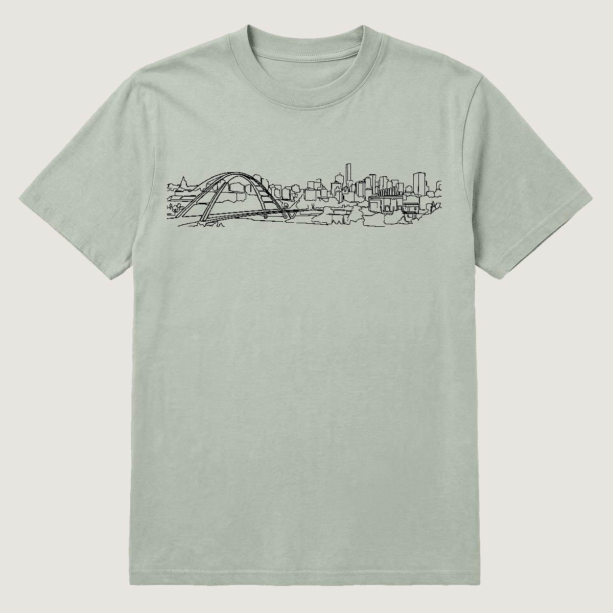 E-Town Tee — the Edmonton skyline and Walterdale Bridge in one continuous line, on a bay garment-dyed heavyweight tee